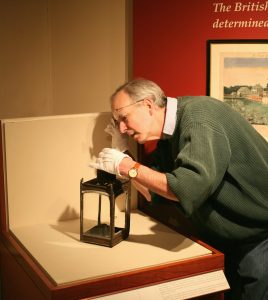 Concord Museum curator David Wood studying the Revere lantern. Courtesy Concord Museum.